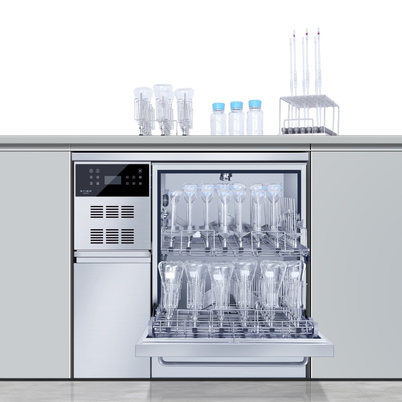 How do laboratory machines clean glassware?